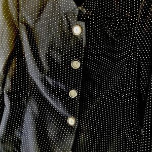 Navy, blue and white polkadotted jacket with a navy blue skirt